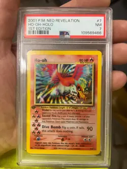 PSA 7 HO-OH 2001 POKEMON NEO REVELATION 1ST EDITION #7/64 HOLO (NEAR MINT) - Image 1