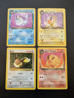 Pokemon Team Rocket Eevee Evolution Set - Dark Jolteon Flareon Vaporeon + Eevee - Image 1