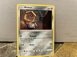 Meltan SM177 Sun & Moon Cosmo Holo Ultra Rare Black Star Promo Pokemon Card NM - Image 1