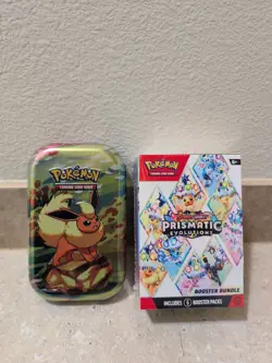 Pokemon TCG Scarlet And Violet Prismatic Evolutions Booster Bundle Sealed & Tin - Image 1