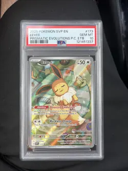 2025 POKEMON PRISMATIC EVOLUTIONS POKEMON CENTER ETB PROMO #173 EEVEE PSA 10 - Image 1