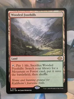 MTG Modern horizons 3 Rare WOODED FOOTHILLS NM - Image 1