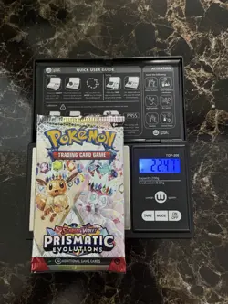 Heavy 22.47 G Pokemon Prismatic Evolutions Booster Pack Sealed! Demi-God PackU! - Image 1