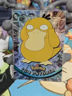1999 Topps Pokemon Psyduck RAINBOW FOIL #54 TV Animation Series Black Logo - Image 1