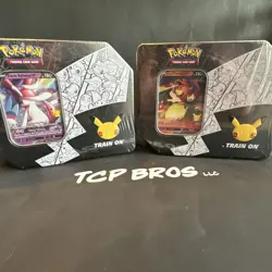 Pokemon 25th Anniversary Celebrations Tin Set: Lance's Charizard & Dark Sylveon - Image 1