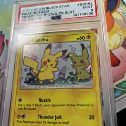 Pokemon TCG Pikachu SM162 SWIRL Black Star Promo Team Up - PSA 9 - Image 2