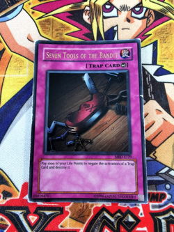 Seven Tools of the Bandit mrd-e129 Unltd Ed (HP) Ultra Rare Yu-Gi-Oh! - Image 1