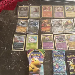 Old Pokemon card collection, mainly from And￼ Moon with sealed packs and a binde - Image 1