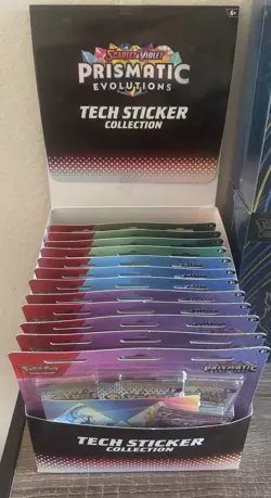 Pokemon TCG Prismatic Evolutions Tech Sticker Sealed Case of 12 - Image 1