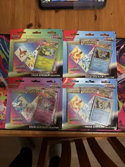 LOT OF 4 Pokemon Prismatic Evolutions Tech Sticker Collection Sealed - Image 1