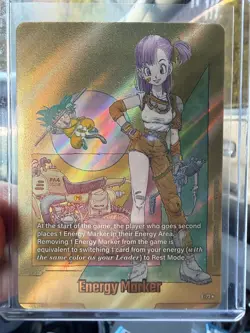 Dragon Ball Super Card Game SB02 Energy Marker E-73* gold Bulma/Kid Goku - Image 1