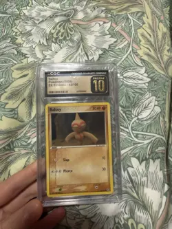 CGC Pristine 10 Baltoy 43/106 EX Emerald Pokemon TCG Card 2005 - Low Pop - Image 1