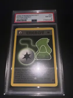 2000 1st Edition Pokemon Rocket Potion Energy Card #82 PSA 8 - Image 1