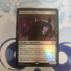MTG: Shakedown Heavy (Streets Of New Capenna)(Rare)(Foil) - Image 1