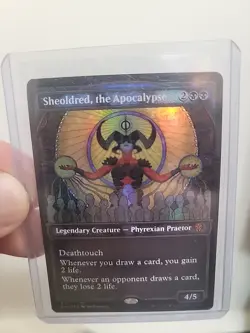 Sheoldred, the Apocalypse (Textured Foil) Dominaria United Foil - Image 1