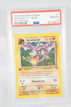 1999 POKEMON FOSSIL 1ST EDITION #1/62 AERODACTYL HOLO RARE PSA 8 - Image 1