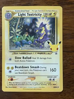 POKEMON CELEBRATIONS LIGHT TOXTRICITY COSMOS HOLO SWSH137 NM CONDITION - Image 1