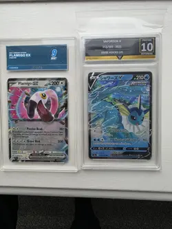 2 x graded pokemon cards flamigo ex and vaporeon v - Image 1