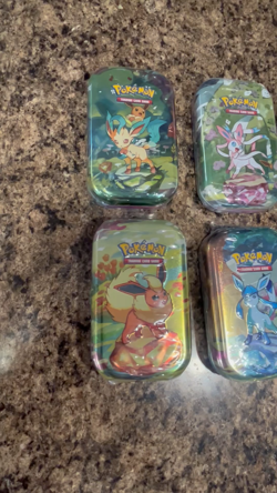 Pokemon Prismatic Evolutions Mini Tin Set of 8 Eeveelutions - Image 2