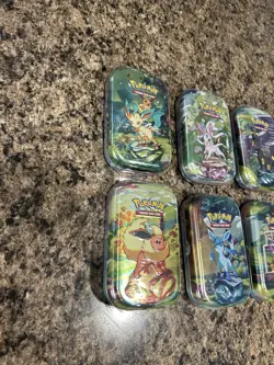 Pokemon Prismatic Evolutions Mini Tin Set of 8 Eeveelutions - Image 4