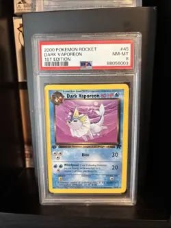 Pokemon 2000 Team Rocket Dark Vaporeon 1st Edition PSA 8 - Image 1