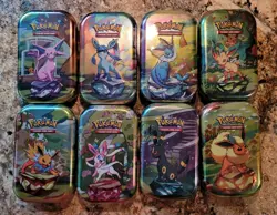 Pokemon Prismatic Evolutions Full Sealed set of 8 Mini Tins - Image 1