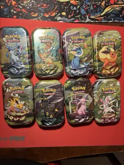Pokemon TCG Prismatic Evolutions Mini Tin Complete Set - 8 Factory Sealed Tins - Image 1