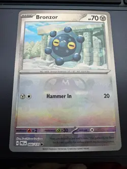 Bronzor (Master Ball) 066/131 Prismatic Evolutions Reverse Holo Pokemon Card - Image 1