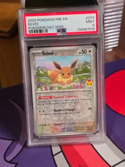 2025 POKEMON PRE EN-PRISMATIC EVOLUTIONS POKEMON DAY 2025 #074 EEVEE PSA 9 - Image 1