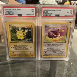 1999 Pokemon Jungle 1st Edition Eevee And Pikachu PSA 8/7 - Image 1