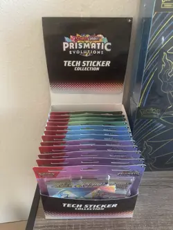Pokemon TCG Prismatic Evolutions Tech Sticker Sealed Case of 12 - Image 1
