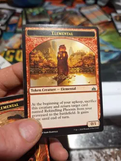MTG Elemental Token - Rekindling Phoenix - Rivals of Ixalan - 0/1 - NM - Image 1