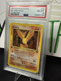 MOLTRES 1ST EDITION HOLO 1999 POKEMON FOSSIL #12/62 PSA 8 - Image 1