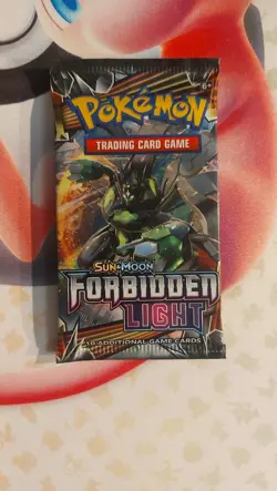 Pokemon TCG Forbidden Light Booster Pack Sun and Moon - Image 1