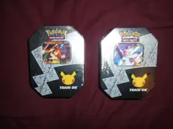 Pokemon Lance's Charizard and Dark Sylveon V Tins Unopened Celebrations 2021 - Image 1