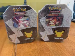 Pokemon Lance's Charizard and Dark Sylveon V Tins Sealed Celebrations 2021 - Image 1