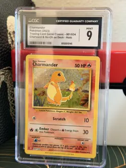 CGC 9 - 2023 POKEMON, CLASSIC CHARIZARD & HO-OH ex DECK 001 CHARMANDER - Image 1