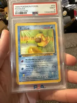 1999 POKEMON FOSSIL 1ST ED #53 PSYDUCK PSA 9 - Image 1