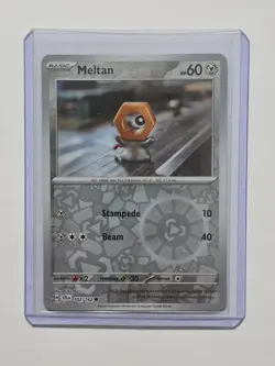 Pokemon TCG Meltan Reverse Holo Card 102/142 Stellar Crown - Image 1