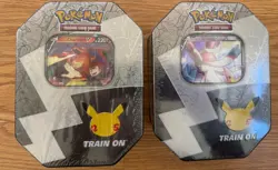 Pokemon 25th Anniversary Celebrations Tin Set: Lance's Charizard & Dark Sylveon - Image 1