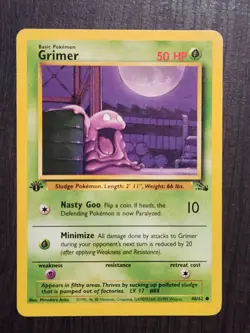1st Edition Grimer Fossil Pokemon Card LP 48/62 Common - Image 1