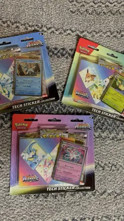 Pokemon Prismatic Evolutions Tech Sticker Booster Pack - Image 1