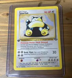 Pokemon Snorlax 27/64 Base Set 1st Edition w/ Top Loader - Image 1