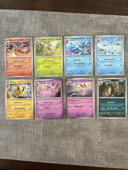 Pokemon Prismatic Evolutions Costco Mini Tin Cosmo Promos 8 Umbreon Sylveon - Image 1