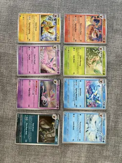 Pokemon Prismatic Evolutions Costco Mini Tin Cosmo Promos 8 Umbreon Sylveon - Image 2