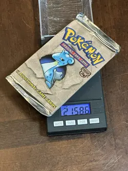 POKEMON FOSSIL BOOSTER PACK LAPRAS ART WOTC 1999 FACTORY SEALED U HEAVY U - Image 1