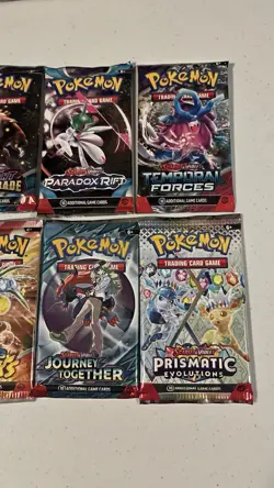 Pokemon Scarlet & Violet Era Sealed Booster Pack Lot of 12 - Prismatic, Paldean - Image 4
