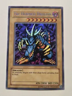 Tri-Horned Dragon LOB-000 WAVY Print Secret Rare Yugioh Unlimited Edition Mint - Image 1