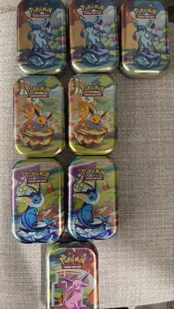 Pokemon Scarlet & Violet Prismatic Evolutions mini tins - Image 1