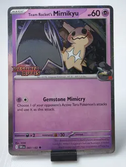 Team Rocket’s Mimikyu 087/182 Stamped Holo Destined Rivals Pokemon Card - Image 1